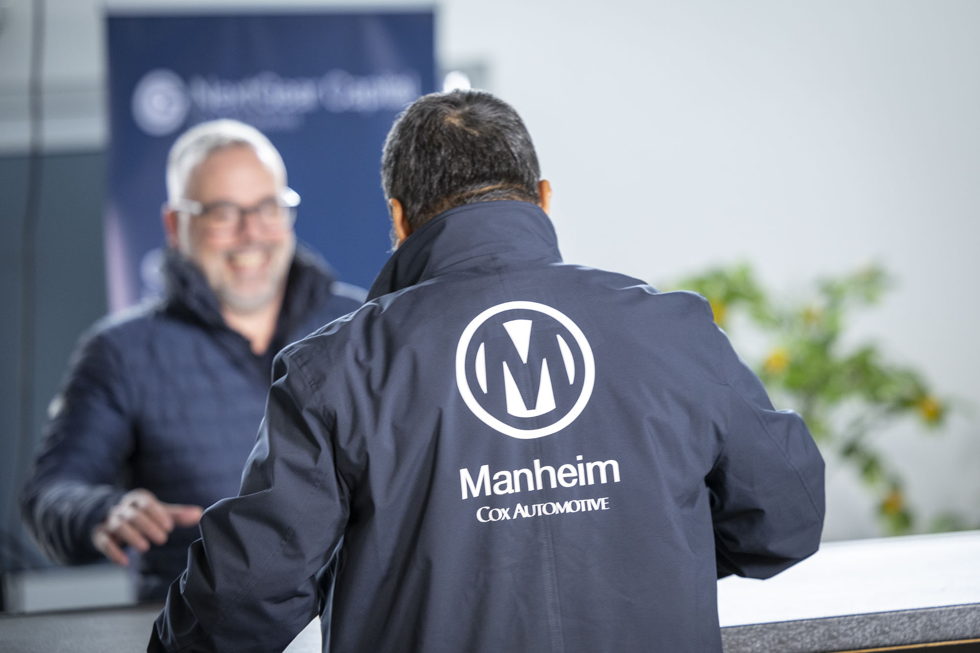 man greeting customer